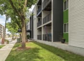 Thumbnail 14 of 19 - outside shot of apartment buildings' patios