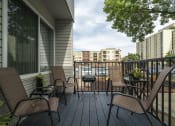 Thumbnail 13 of 19 - furnished patio with buildings behind it