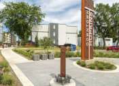 Thumbnail 16 of 19 - outdoor footpaths and a sign that reads "Downtown Hopkins"