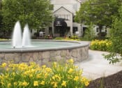 Thumbnail 19 of 23 - Large water fountain in front of the entrance to the apartment lobby