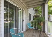 Thumbnail 5 of 23 - Personal outdoor patio with two blue chairs