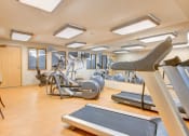 Thumbnail 12 of 26 - Fitness center with treadmills and other equipment