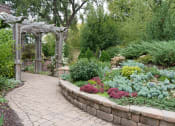 Thumbnail 25 of 27 - Garden with stone pathway and sun terrace