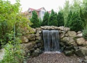 Thumbnail 27 of 27 - Stone water fountain in a garden