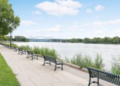 Thumbnail 24 of 27 - Park benches up and down the side of the river