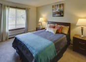 Thumbnail 5 of 19 - Bedroom, wall art, green and purple bedspread, and lamps