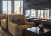 Thumbnail 26 of 42 - Chair next to gas fireplace