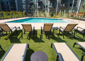Thumbnail 8 of 42 - Outdoor lounge seating overlooking pool