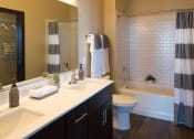 Thumbnail 15 of 42 - Bathroom with twin sinks