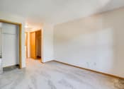 Thumbnail 2 of 26 - Empty bedroom with white carpet and walls