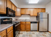 Thumbnail 1 of 26 - Kitchen with wooden cabinets and stainless steel appliances