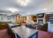 Thumbnail 10 of 26 - Community room with a variety of conversational seating