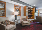 Thumbnail 9 of 26 - Clubroom with chairs and a bookshelf