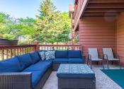 Thumbnail 13 of 26 - Outdoor patio with blue chairs
