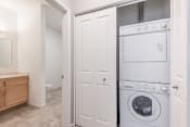 Thumbnail 15 of 40 - Washer and dryer behind closet doors