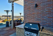 Thumbnail 23 of 29 - Grill and patio seating on the roof