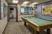 Thumbnail 11 of 17 - Rec room with a pool table and view of small fitness room