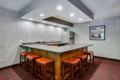 Thumbnail 11 of 27 - Community room kitchen with U shaped table and seating