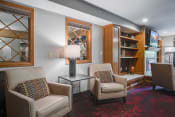 Thumbnail 9 of 27 - Clubroom with chairs and a bookshelf