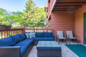 Thumbnail 13 of 27 - Outdoor patio with blue chairs