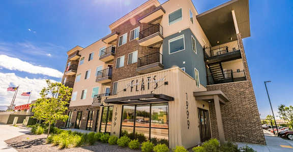 A modern building with the word "Flair" on the front.