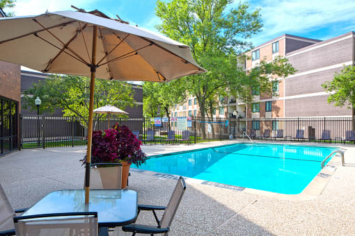 Outdoor pool with umbrella tables