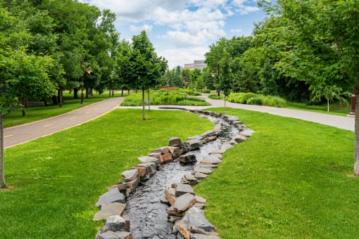 Stone water feature along a promenade/bike trail