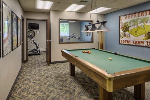 Rec room with a pool table and view of small fitness room