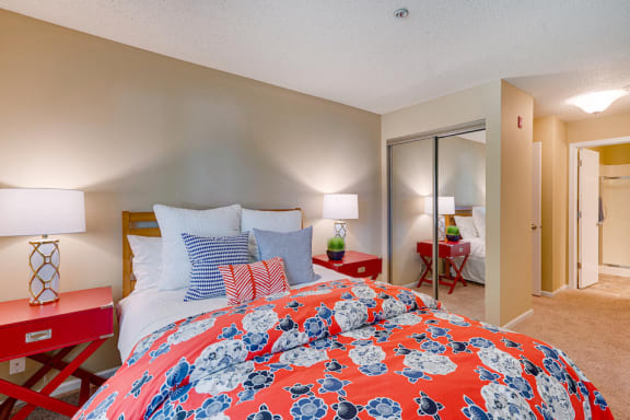 Bedroom with red comforter on the bed