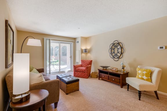 Living room with lamps, sofa, and chairs