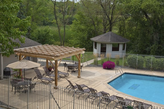 Outdoor pool with lounge chairs and sun terrace