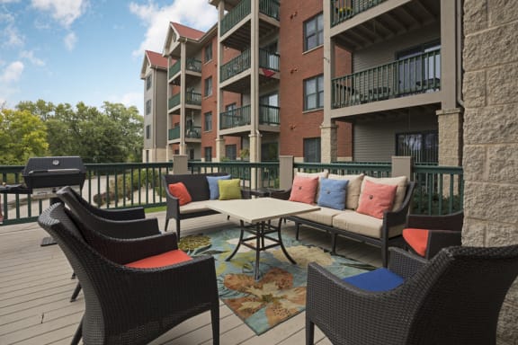 Outdoor deck with patio seating and a grill