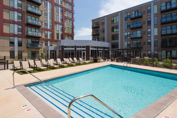 Outdoor pool with lounge chairs on the pool deck