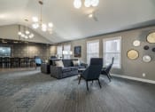 Thumbnail 10 of 22 - Community room with sofa and conversational seating