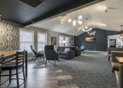 Thumbnail 11 of 22 - Community room with different kinds of chairs and tables