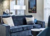 Thumbnail 16 of 22 - Blue couch in the community room