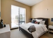 Thumbnail 14 of 42 - Bedroom with queen sized bed, nightstands with lamps, and a dresser