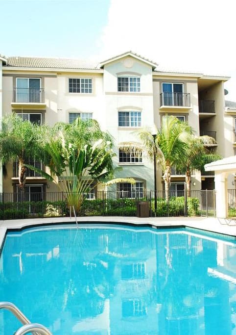 Pool with lounge chairs Harbour Cove Hallandale Beach Florida at Harbour Cove, Hallandale Beach, FL 33009