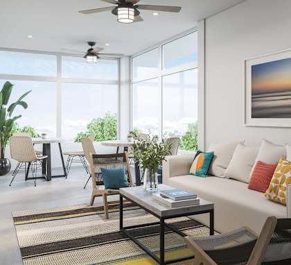 a rendering of a living room with a couch and a coffee table with a vase of