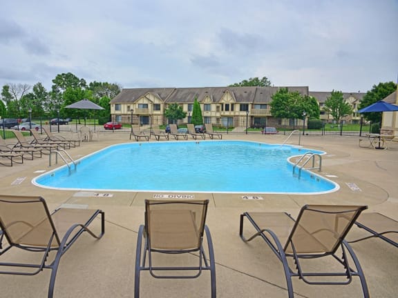 Outdoor pool with large sundeck at Tanglewood Apartments in Oak Creek, WI