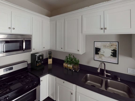 Kitchen With Stainless Steel Appliances at Barton Apartments