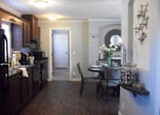 Thumbnail 3 of 11 - Dining Area and Kitchen at Pine Village Rental Home Community in Sanford, NC