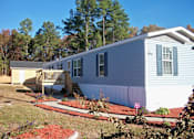 Thumbnail 1 of 11 - Property Exterior at Pine Village Rental Home Community in Sanford, NC