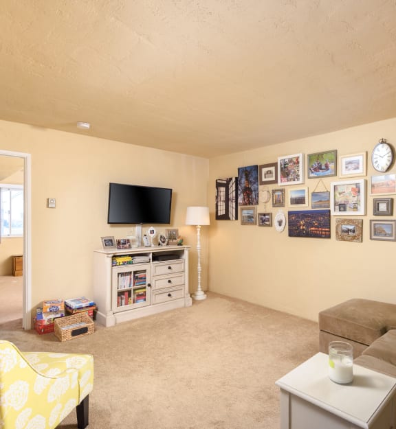 a living room with a couch and a tv