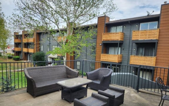a living room with a couch a chair and a tvat The Lodge Apartments, Tulsa, 74129