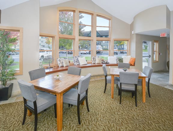 Tables and Chairs at the Clubhouse with Large Windows
