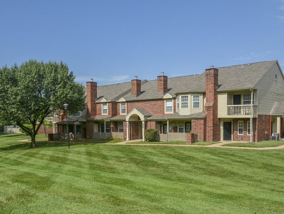 Lush Green Grass In Front Of a Willowbend Apartment Building