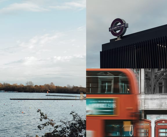 a red double decker bus driving by the water and a building with a sign