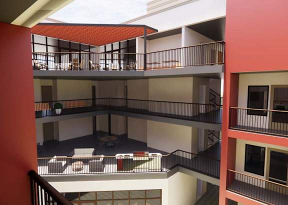 A red and white building with a balcony and a staircase. at Vintage at Lockwood Apartments, Oxnard 93036