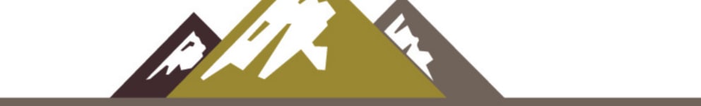 a green and brown pyramid with a mountain in the background